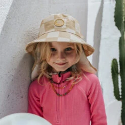 Plow Surf Co. | Beach Beige | Plow Surf Hat | Surfing Hat | Beach + Water Activity Headwear | -FCS Store Buy Plow Surf Co Beach Beige Surfing Hat With Chin Strap Girls 35957.1692945031