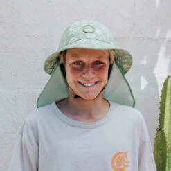 Plow Surf Co. | Gumnut Green Floral | Plow Surf Hat | Surfing Hat | Beach + Water Activity Headwear | -FCS Store Buy Plow Surf Co Gumnut Green Floral Surfing Hat With Chin Strap Boys 83242.1692943844