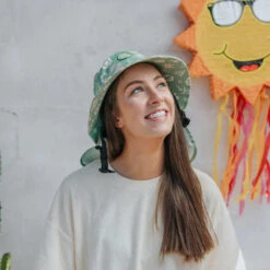 Plow Surf Co. | Gumnut Green Floral | Plow Surf Hat | Surfing Hat | Beach + Water Activity Headwear | -FCS Store Buy Plow Surf Co Gumnut Green Floral Surfing Hat With Chin Strap Ladies 87634.1692943660