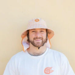 Plow Surf Co. | Orange Gingham | Plow Surf Hat | Surfing Hat | Beach + Water Activity Headwear | -FCS Store Buy Plow Surf Co Orange Gingham Surfing Hat With Chin Strap Mens 70252.1692946053